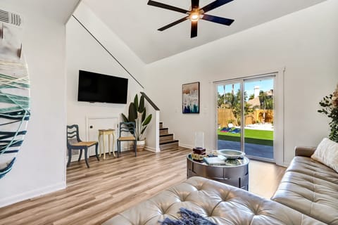 Bright open living space with comfy seating and backyard access.