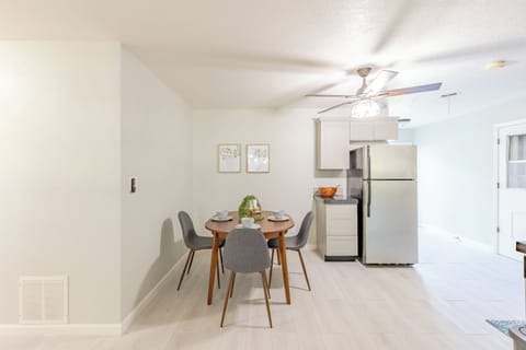 Bright kitchen featuring a cozy table set for four guests.