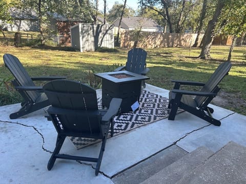 Relax under the stars on the patio with a propane fire pit and seating for four.