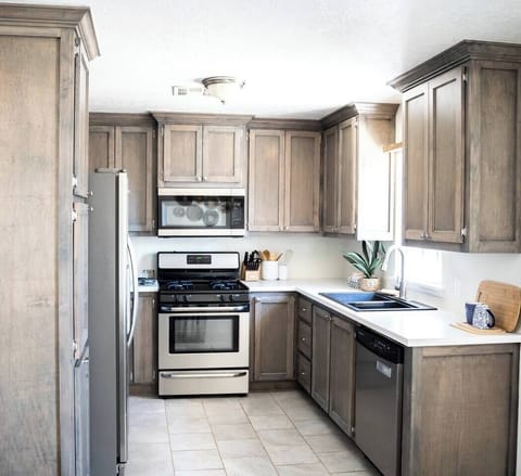 Bright kitchen featuring a cozy table set for four guests.