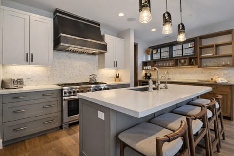 Gourmet kitchen featuring a professional-grade range, custom cabinetry, and ample prep space. Foundry Haus blends function and elevated design seamlessly