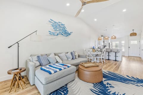 Spacious living room with access to the back porch.