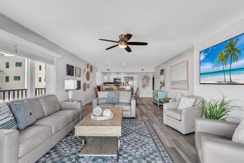 Living Room is Comfortably Furnished with Leather Sofa, Loveseat, and Armchairs