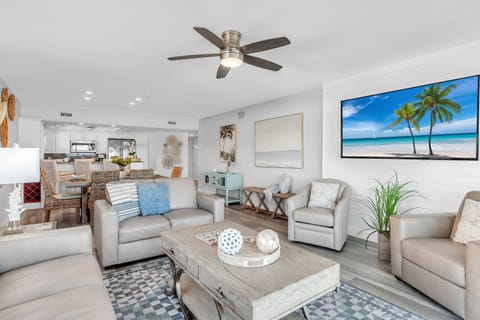 Living Room is Comfortably Furnished with Leather Sofa, Loveseat, and Armchairs