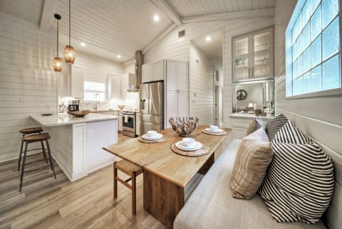 Elevating culinary artistry with a modern touch of white and rustic wood. (Clamshell Cottage)