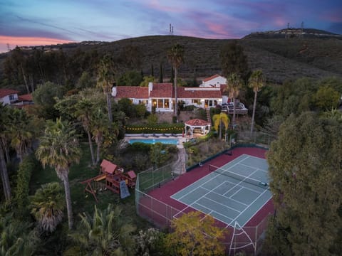 This resort-like backyard offers something for everyone, from the tennis enthusiast to the sunbather. (The Tennis Ranch)