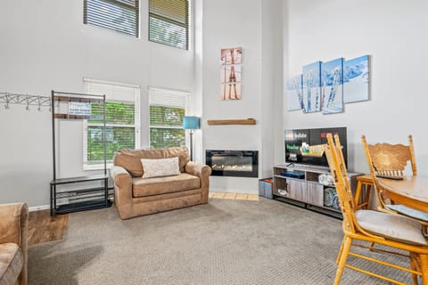 Vaulted ceilings, large TV, and cozy fireplace provide a nice retreat from your day's adventures.