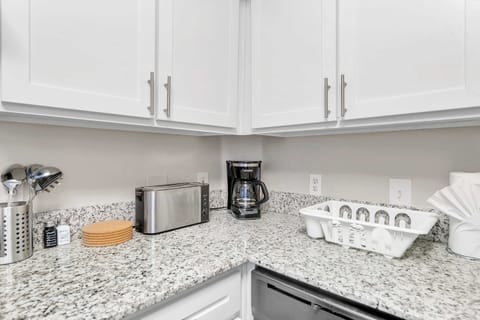 Polished kitchen counters w/ plenty of prep space & modern style.