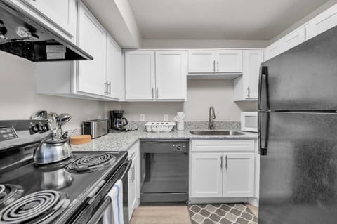 Sleek kitchen w/ stainless appliances & clean, modern finishes.