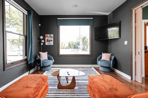 Chic and cozy living space just steps from Mass Ave — modern design, bold colors, and the perfect spot to unwind.