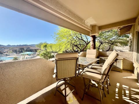 Large balcony overlooking the pool and spa