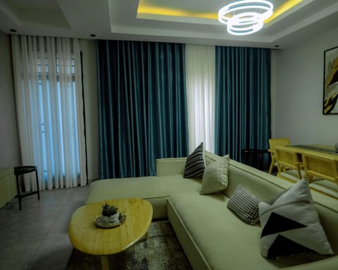 Deluxe Apartment, Balcony | Living area | TV