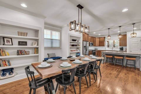 Expansive 9-foot table allows flexibility to serve 10 guests and provides ample space for board games found on the built-in shelves.