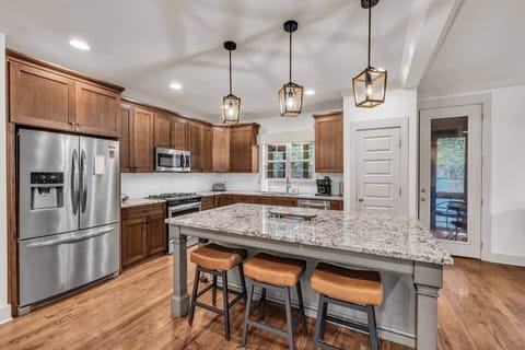 Plan on staying in for the night? Grab some groceries at the Publix 5 minutes away and enjoy cooking in this well appointed spacious kitchen while conversing with friends and family in the connected living spaces.