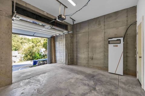 Left garage bay fits a sedan or mid-size SUV.