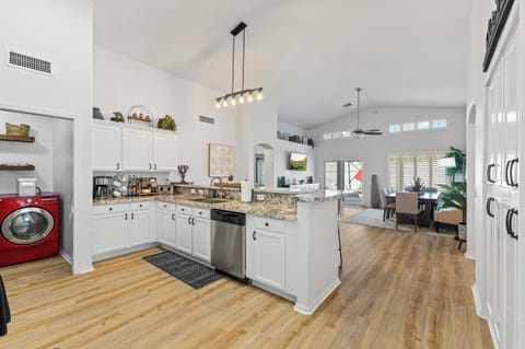 Huge gourmet kitchen with dining for 12 that looks out to the pool.