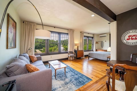 Enjoy our most spacious, window-filled room with a table and couch to work and relax
