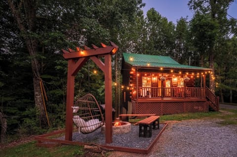 Escape to this charming retreat with a fire pit and warm patio glow.