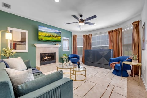 Whole room of the living room with ceiling fan, and TV