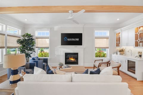Bright living room area with fireplace and flatscreen TV
