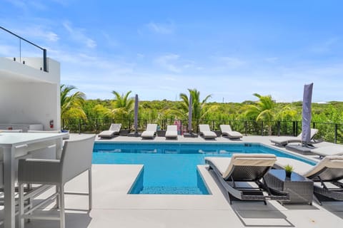 Poolside bar seating perfect for outdoor dining.