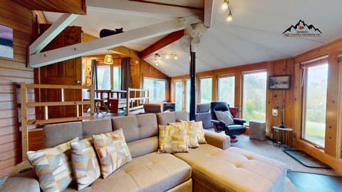 Relax in the unique sunken living room with two cozy fireplaces and front-row views of skiers on Lower Flying Mile.