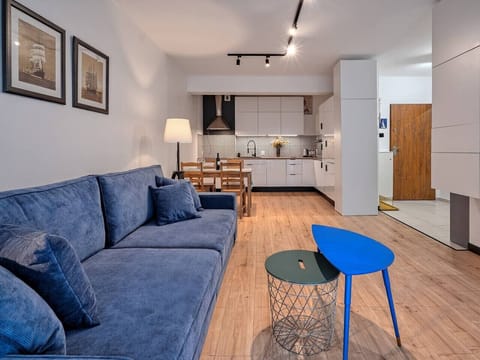 Spacious Living Area with Large Sofa and Cozy Lighting | Book Now with RENTUJEMY.COM