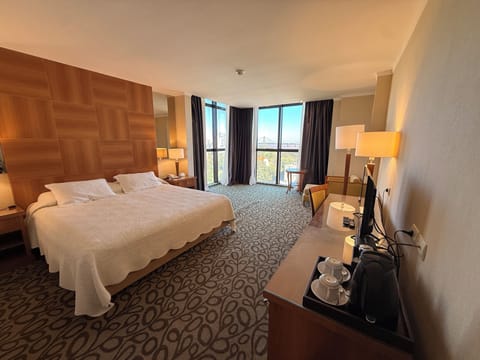 Superior Double Room, River View | Minibar, in-room safe, desk, laptop workspace