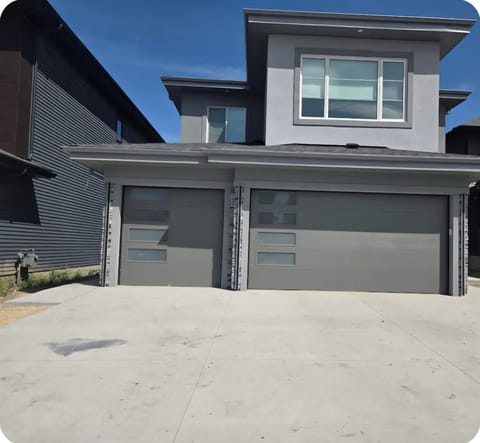 Front view of the house with the sidewalk on the left to the basement Suites.