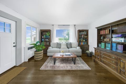 Sunlit living room with games and books to enjoy!