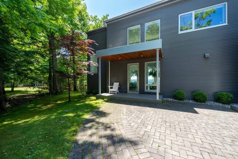 Modern calm, forest views, and a warm welcome—this patio says, you've arrived.