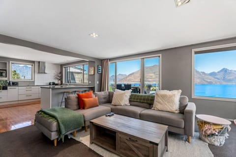 Lounge area: Unwind with stunning lake views and vibrant decor in this stylish retreat!