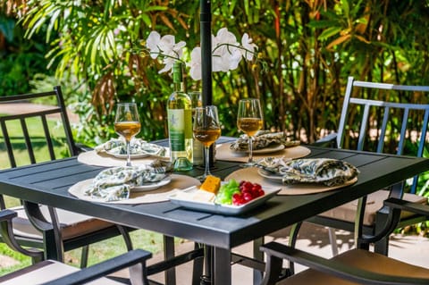 Outdoor dining with a new patio table for four, great for enjoying meals or morning coffee al fresco.