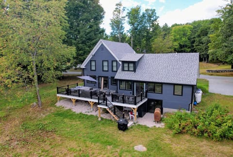 Step onto the expansive deck, where you'll find ample outdoor seating