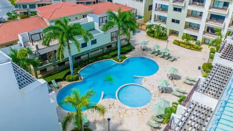 Ample sun loungers and stylish umbrellas are scattered throughout the spacious patio, ensuring you always have the perfect spot to soak up the sun or find some shade.