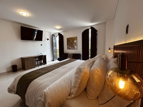 Junior Suite, City View | In-room safe, desk, free WiFi, bed sheets