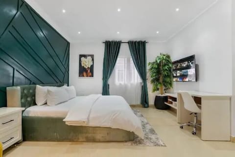 Family Apartment, Balcony, City View | Desk, laptop workspace, blackout drapes, soundproofing