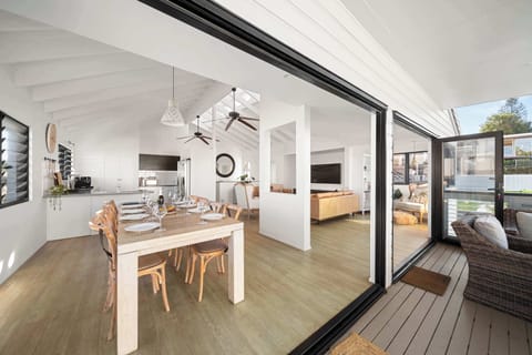 The open-plan living area offers plenty of space to gather after a day by the beach.