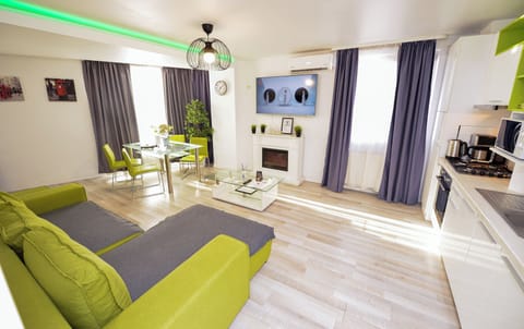Family Apartment, Balcony | Living area | 40-inch plasma TV with digital channels, Netflix, streaming services