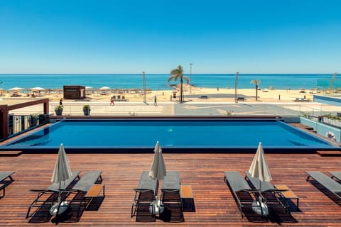 Outdoor pool, open 9:00 AM to 8:00 PM, pool umbrellas, sun loungers
