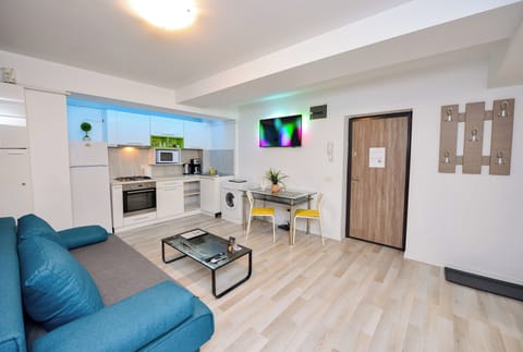 Luxury Apartment | Living room | 40-inch LCD TV with cable channels, Netflix, streaming services