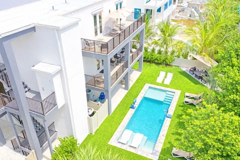 Balconies overlooking beautiful pool and lounging area.