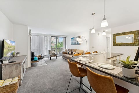 Bright and cozy open-concept living space with a fully equipped kitchen, comfy seating, and plenty of natural light. Perfect for relaxing after a day of adventure!