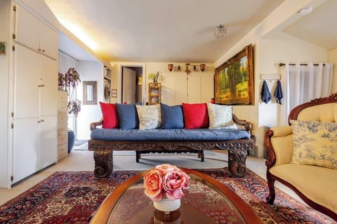 Cozy living space with classic décor, comfortable seating, and warm touches that create a welcoming atmosphere.