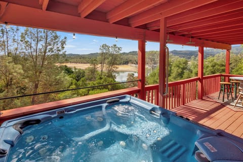 Relax and Unwind in the hot tub overlooking the lake.