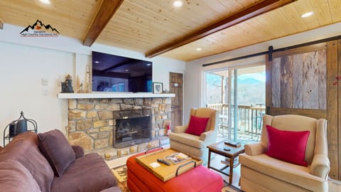 Living Room with Gas Fireplace and Sliding Door leading to the deck
