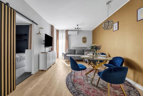 Living Room with Sofa Bed, Dining Table and Smart TV | Book Now with RENTUJEMY.COM