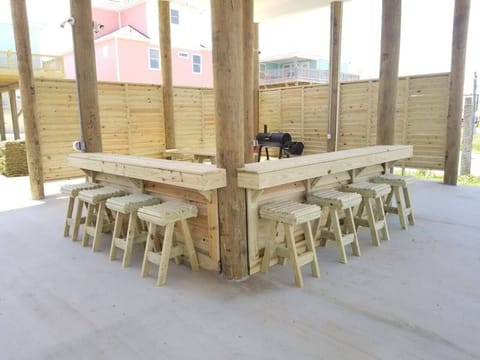 Under house entertaining area with charcoal grill