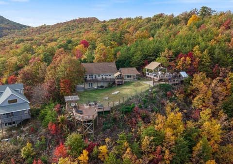 Exterior aerial cabin view surrounded by scenic mountain foliage
