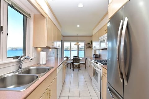 Kitchen view of breakfast nook and Seneca Lake
